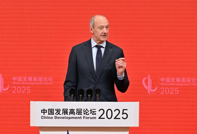 Roland Busch, Co-Chair of CDF, CEO of Siemens AG delivers an opening speech in Beijing, Mar 23, 2025. (CFP Photo)
