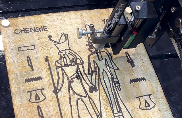 Machine printing hieroglyph on Egyptian’s ancient writing material papyrus.
